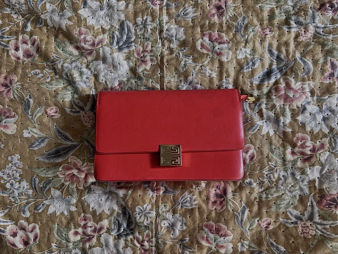 Red Leather Clutch Bag with Gold Clasp (Category: Luxury Bags & Wallets) located in Manila. Submitted by urechicthrftmnl (Listing ID 1455608530, Image 1). Description: - Genuine Givenchy red leather clutch - Features the iconic gold clasp closure - Compact size, ideal for evening events or as a statement accessory - Additional gold zipper detail at the top - Smooth, high-quality leather feel - [Insert measurement here if known].