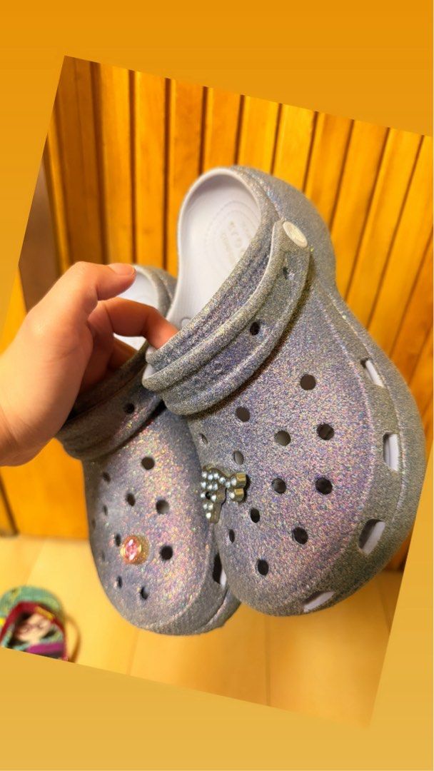 Glitter Crocs with Charms (Category: Slippers and slides) located in Quezon City. Submitted by azir88 (Listing ID 1455661695, Image 2). Description: - Sparkly glitter Crocs - Comes with cute charms already attached - Easy slip-on and off design - Super comfy for casual wear and lounging - Unique shimmer effect.