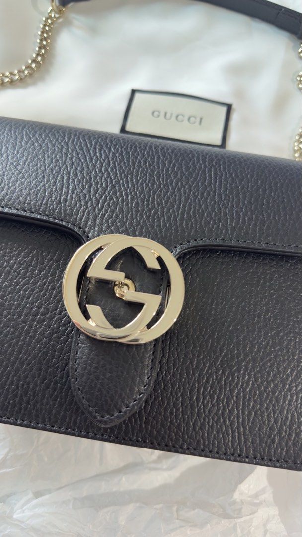 Gucci Black Leather Interlocking G Chain Shoulder Bag (Category: Luxury Bags & Wallets) located in Makati City. Submitted by mitch_jlc (Listing ID 1455612740, Image 3). Description: - Authentic Gucci black leather shoulder bag - Iconic silver interlocking G logo - Comes with silver chain strap and leather shoulder strap - Beige fabric interior lining - Made in Italy - Dust bag included - G logo is PPF by Olympus of R33 cars Rare and discontinued 