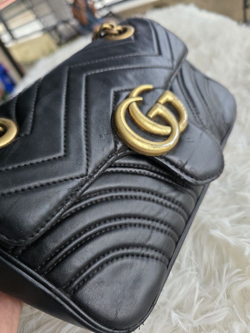 Gucci Marmont Black Leather Chain Shoulder Bag (Category: Luxury Bags & Wallets) located in Lemery. Submitted by venus23 (Listing ID 1455609939, Image 3). Description: - Black Leather Gucci Marmont Bag - Iconic GG Logo and Chevron Quilting - Gold-Tone Chain Strap - Shows some signs of wear on hardware and leather edges (adds character!) - Perfect size for your daily essentials - Versatile for both day and night use.