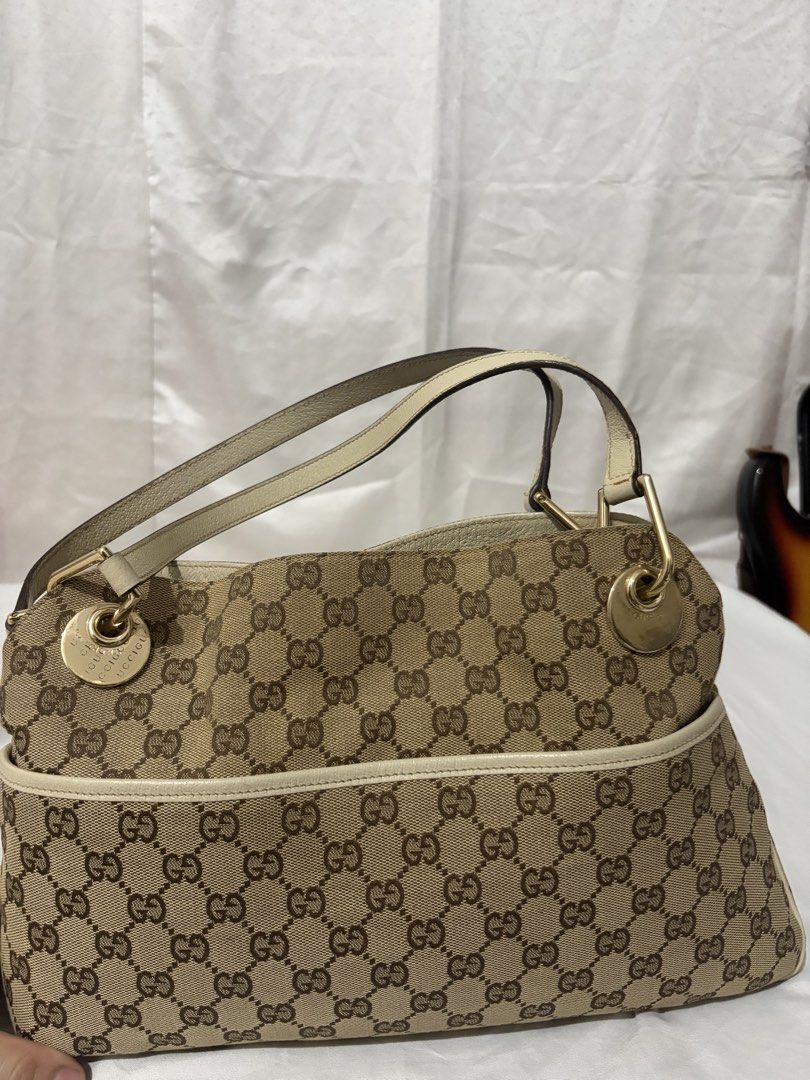 Gucci Monogram Bag (read desc) (Category: Luxury Bags & Wallets) located in Quezon City. Submitted by clareb (Listing ID 1455630204, Image 1). Description: PRICE IS NEGOTIONABLE FOR SURE BUYERS (w a freebie) + PAYO ❗️ - Brand: Gucci - Type: Handbag - Model: Monogram - Color: Beige/Cream with Gold Hardware - Design: Iconic GG monogram canvas - Accents: Cream leather trim - Hardware: Gold-tone - Style: Elegant and versatile .