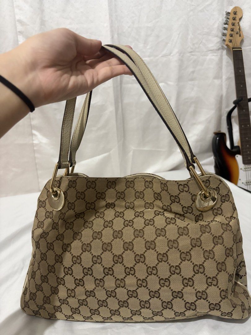 Gucci Monogram Bag (read desc) (Category: Luxury Bags & Wallets) located in Quezon City. Submitted by clareb (Listing ID 1455630204, Image 2). Description: PRICE IS NEGOTIONABLE FOR SURE BUYERS (w a freebie) + PAYO ❗️ - Brand: Gucci - Type: Handbag - Model: Monogram - Color: Beige/Cream with Gold Hardware - Design: Iconic GG monogram canvas - Accents: Cream leather trim - Hardware: Gold-tone - Style: Elegant and versatile .