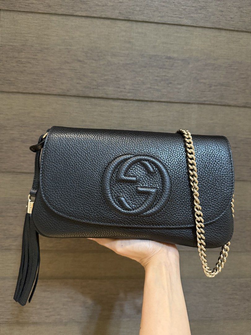 Gucci Soho Flap Bag (Category: Luxury Bags & Wallets) located in Manila. Submitted by sweetluxuryph (Listing ID 1455628894, Image 2). Description: - Authentic Black Leather Gucci Soho Flap Bag - Features Gold Chain Strap and Iconic Tassel Detail - Comes with Complete Set: Dust Bag & Authenticity Cards - Original Store Price Approx. ₱180,000 - Excellent Value - Don't Miss Out!.