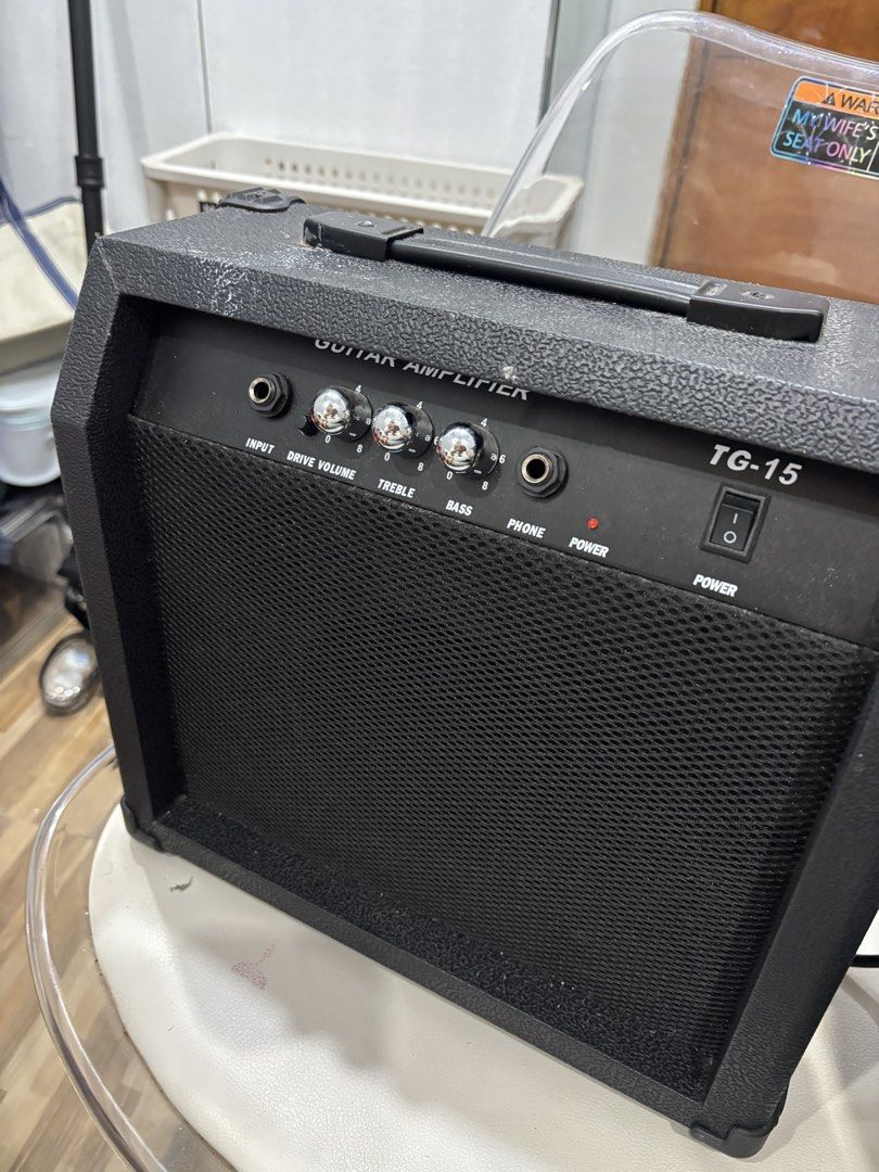 Guitar Amplifier TG-15 (Category: Musical Instruments) located in Manila. Submitted by alliesoju (Listing ID 1455598226, Image 2). Description: has input, drive, volume, treble, and bass controls. also includes a phone output and power switch. working well—never been used, na-stock lang kaya nadumihan..