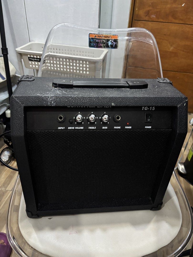 Guitar Amplifier TG-15 (Category: Musical Instruments) located in Manila. Submitted by alliesoju (Listing ID 1455598226, Image 1). Description: has input, drive, volume, treble, and bass controls. also includes a phone output and power switch. working well—never been used, na-stock lang kaya nadumihan..