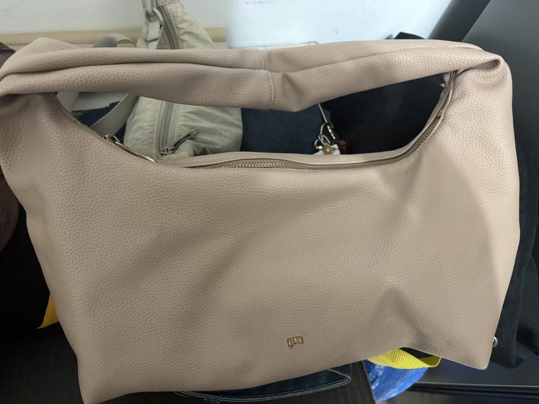Gvn Medium Taupe Leather Hobo Bag (Category: Shoulder Bags) located in Manila. Submitted by il6_eilsel (Listing ID 1454263953, Image 3). Description: No flaws ! Just needs cleaning on the inside (dm for pictures) Rfs: decluttering Sf must be shouldered by the buyer .