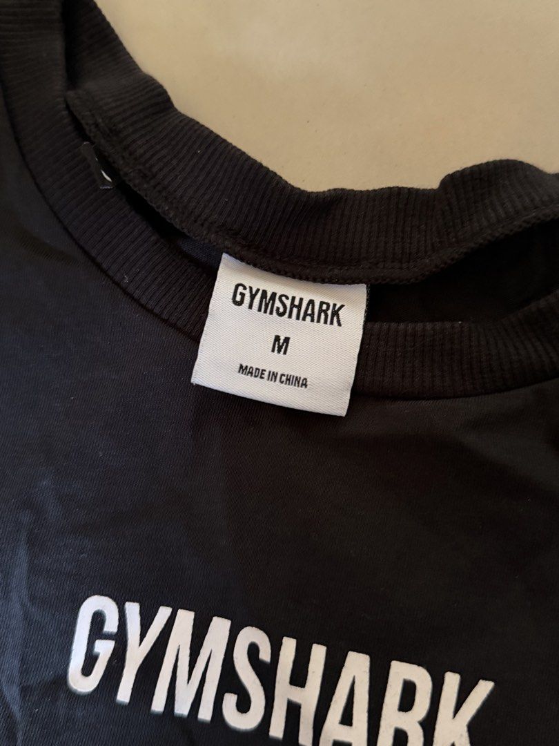 Gymshark Black Cropped Tank Top (Category: Activewear) located in Oroquieta. Submitted by rjayy14 (Listing ID 1455660135, Image 3). Description: - Brand: Gymshark - Type: Cropped Tank Top - Color: Black - Size: Medium (M) - Neckline: Crew Neck - Sleeves: Sleeveless - Features: Gymshark logo on front - Ideal for: Workouts, gym sessions, casual wear - Material: Comfortable and breathable.