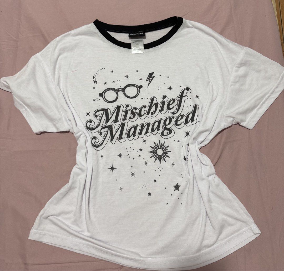 Harry Potter Mischief Managed Ringer T-Shirt (Category: Shirts) located in Muntinlupa City. Submitted by sunwonx (Listing ID 1455607639, Image 1). Description: - White ringer t-shirt - Black collar and sleeves - Features 'Mischief Managed' graphic from Harry Potter - Adorned with stars and lightning bolts - Perfect for Harry Potter fans - Comfortable and casual wear.