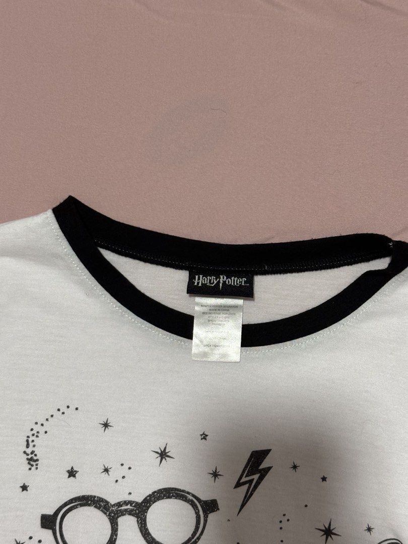 Harry Potter Mischief Managed Ringer T-Shirt (Category: Shirts) located in Muntinlupa City. Submitted by sunwonx (Listing ID 1455607639, Image 2). Description: - White ringer t-shirt - Black collar and sleeves - Features 'Mischief Managed' graphic from Harry Potter - Adorned with stars and lightning bolts - Perfect for Harry Potter fans - Comfortable and casual wear.