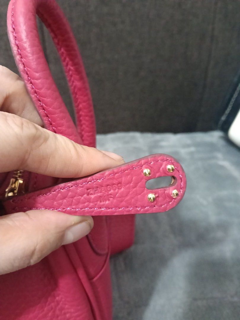 Hermes Lindy Bag Pink Leather 18cm (Category: Luxury Bags & Wallets) located in Cebu City. Submitted by latendacebubuys (Listing ID 1455553718, Image 3). Description: - Stylish pink leather handbag - Elegant gold hardware accents - Versatile carrying options: shoulder strap and top handles - Secure zipper closure - Decorative lock detail on the front flap - Note: Some creasing on the leather exterior - Interior is clean and well-maintained.