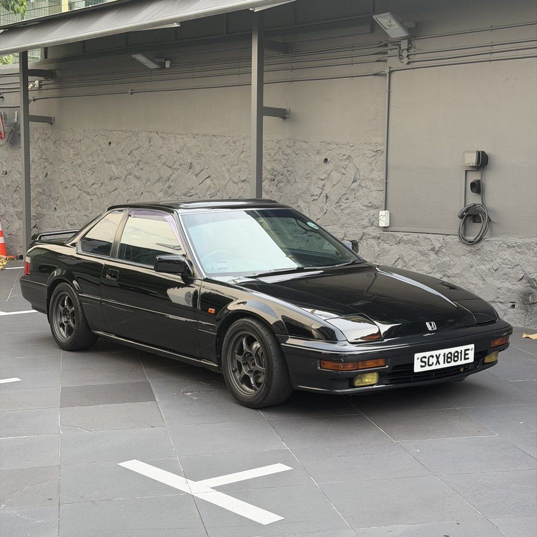 Honda Prelude 2.0M Manual (Category: Used Cars) located in Singapore. Submitted by jdmaftermarket (Listing ID 1455577799, Image 1). Description: No dealers pls, not looking for consignment. 3 left in sg, black plate. A car with character, pop up lights, 80s wedge shape, sunroof, can sit 5 pax and a giant rear boot space. Only one with rare dark blue interior. Engine overhauled + car resprayed at 310,000km, almost everything has been replaced. Sam