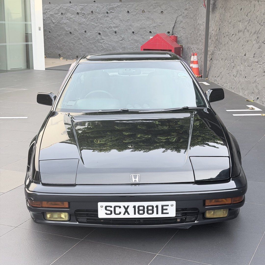 Honda Prelude 2.0M Manual (Category: Used Cars) located in Singapore. Submitted by jdmaftermarket (Listing ID 1455577799, Image 2). Description: No dealers pls, not looking for consignment. 3 left in sg, black plate. A car with character, pop up lights, 80s wedge shape, sunroof, can sit 5 pax and a giant rear boot space. Only one with rare dark blue interior. Engine overhauled + car resprayed at 310,000km, almost everything has been replaced. Sam