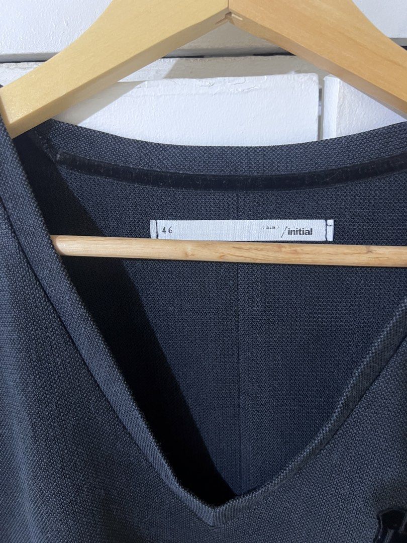 Initial Black V-Neck Long Sleeve Shirt Size 46 (Category: Tshirts & Polo Shirts ) located in Quezon City. Submitted by airajaime (Listing ID 1455536215, Image 3). Description: - Brand: Initial - Color: Black - Style: Long-sleeved, V-neck - Design: Small emblem on chest - Size: Tagged 46 - Features: Simple, classic, good for layering or wearing alone.