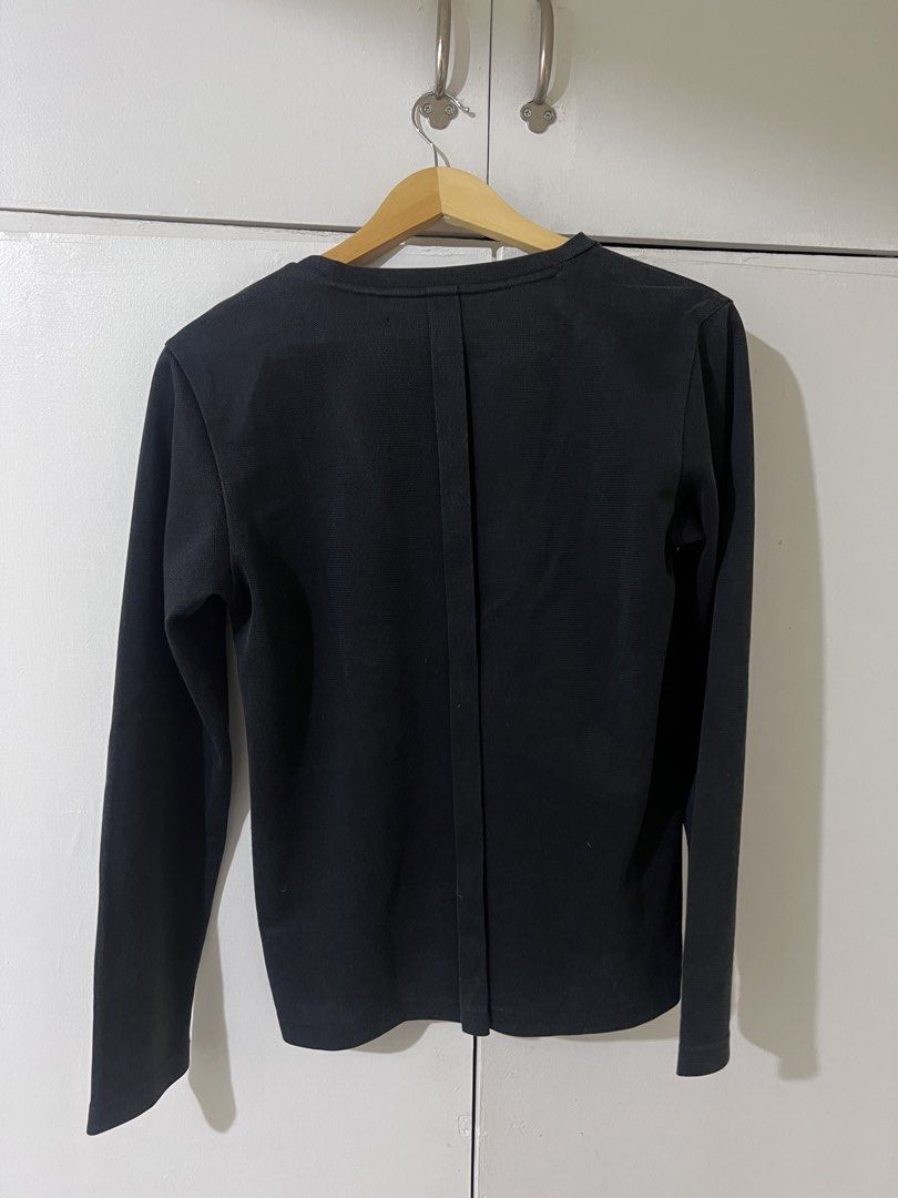 Initial Black V-Neck Long Sleeve Shirt Size 46 (Category: Tshirts & Polo Shirts ) located in Quezon City. Submitted by airajaime (Listing ID 1455536215, Image 2). Description: - Brand: Initial - Color: Black - Style: Long-sleeved, V-neck - Design: Small emblem on chest - Size: Tagged 46 - Features: Simple, classic, good for layering or wearing alone.