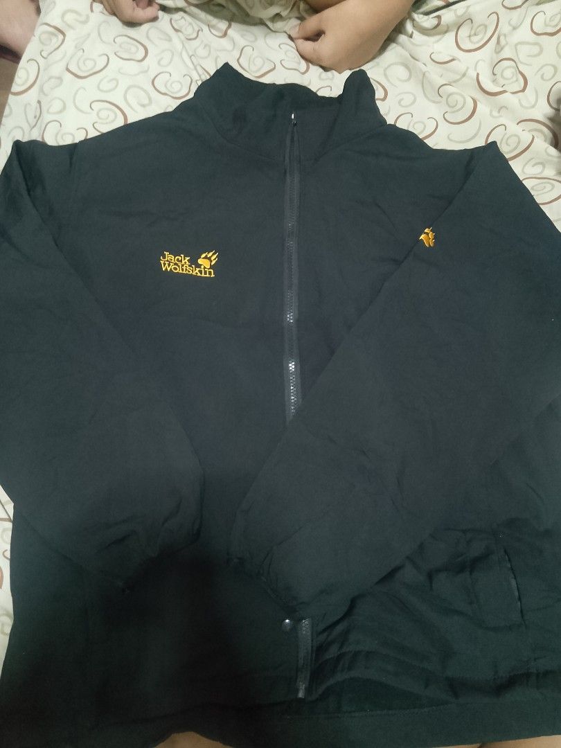 Jack Wolfskin Black Jacket (Category: Coats, Jackets and Outerwear) located in Manila. Submitted by azurejoshua (Listing ID 1455641311, Image 1). Description: - Authentic Black Jack Wolfskin jacket - Features signature paw logo on chest and sleeve - Full zipper closure - Two convenient front pockets - Comfortable and casual design - Perfect for outdoor adventures or daily wear.