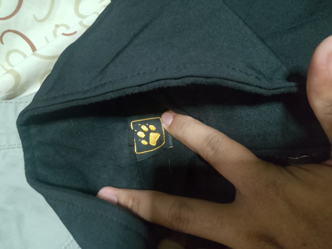Jack Wolfskin Black Jacket (Category: Coats, Jackets and Outerwear) located in Manila. Submitted by azurejoshua (Listing ID 1455641311, Image 2). Description: - Authentic Black Jack Wolfskin jacket - Features signature paw logo on chest and sleeve - Full zipper closure - Two convenient front pockets - Comfortable and casual design - Perfect for outdoor adventures or daily wear.