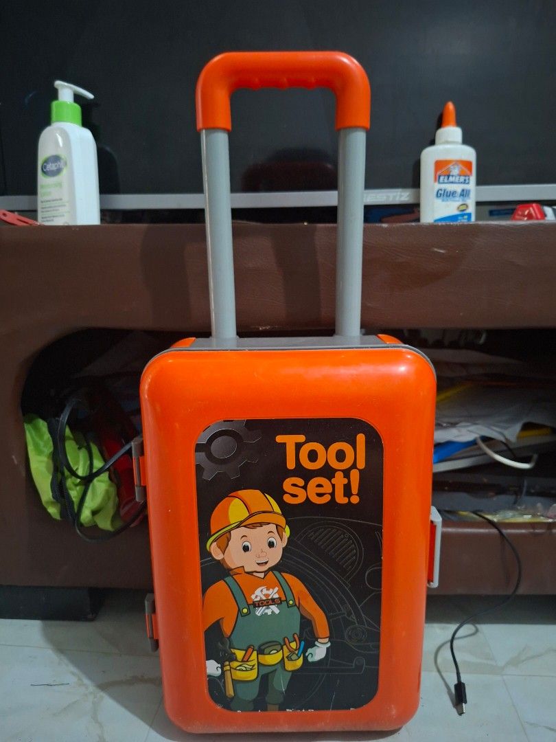 Kids Toy Tool Set with Rolling Suitcase (Category: Kids Toys) located in Makati City. Submitted by arempaz (Listing ID 1455563810, Image 3). Description: Kids' toy tool set with saw, wrench, hammer. Packs into a rolling suitcase with handle. Perfect for pretend play! As is, where is. Location: Brgy Conchu, Trece.