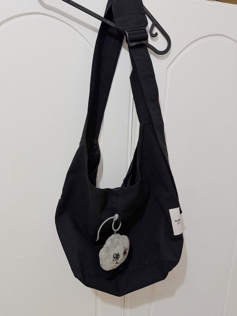 Kirsake Mono Original Canvas Tote Bag (Category: Cross-body Bags) located in Manila. Submitted by planet.mars (Listing ID 1455547661, Image 2). Description: - Kirsake mono black (BINI Jhoanna and Aiah bag) - Adjustable strap for comfortable wear - Ideal for everyday use PRODUCT DESCRIPTION Origin: Made in Philippines Material: Thick & Heavy Canvas Bag Size: Large, Can fit 12”-15” Laptops Bag Measurements in Inches Height: 11 Length: 18 Width: 5.9