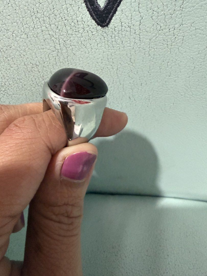Large Dark Stone Statement Ring Silver Band (Category: Rings) located in Valenzuela. Submitted by joy_2da_world (Listing ID 1455623713, Image 3). Description: - Statement ring with a large, dark, faceted stone. - Silver-toned, chunky, bold band. - Unique piece to add edge to any outfit. - Stone color: Deep purple or dark red with lighter streaks. Not sure if amethyst pero sabi nung nagbenta sa carousell dati, amethyst raw to. Has weight to it (ma