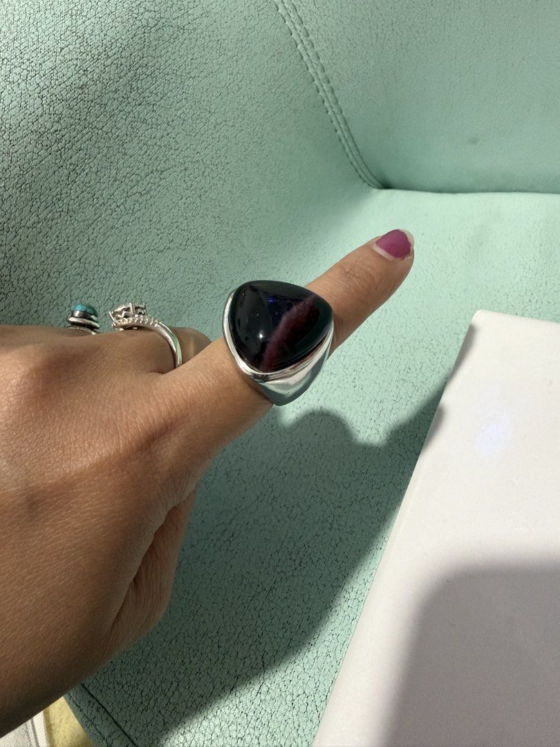 Large Dark Stone Statement Ring Silver Band (Category: Rings) located in Valenzuela. Submitted by joy_2da_world (Listing ID 1455623713, Image 1). Description: - Statement ring with a large, dark, faceted stone. - Silver-toned, chunky, bold band. - Unique piece to add edge to any outfit. - Stone color: Deep purple or dark red with lighter streaks. Not sure if amethyst pero sabi nung nagbenta sa carousell dati, amethyst raw to. Has weight to it (ma