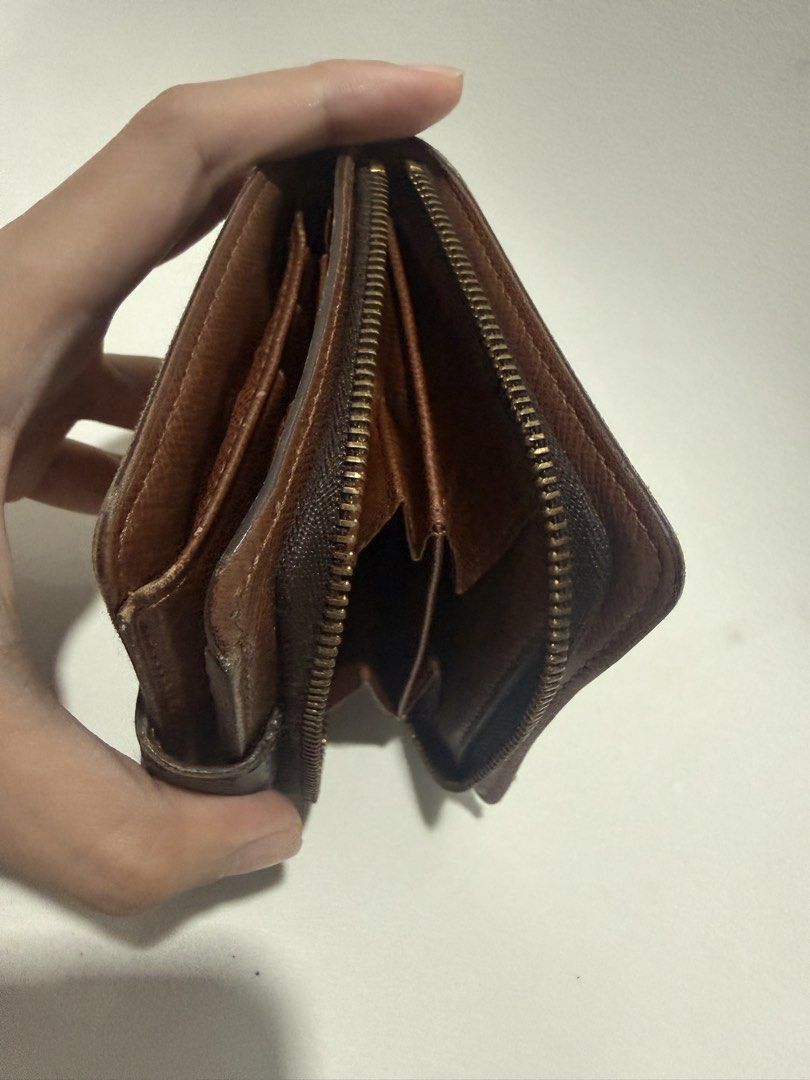 Louis Vuitton Monogram Canvas Bifold Wallet (Category: Luxury Bags & Wallets) located in Caloocan City. Submitted by krishazach (Listing ID 1455593931, Image 3). Description: - Authentic Louis Vuitton wallet - Classic monogram canvas - Bifold design - Zip coin pocket - see pics for the defects/issues - Smooth working zipper .