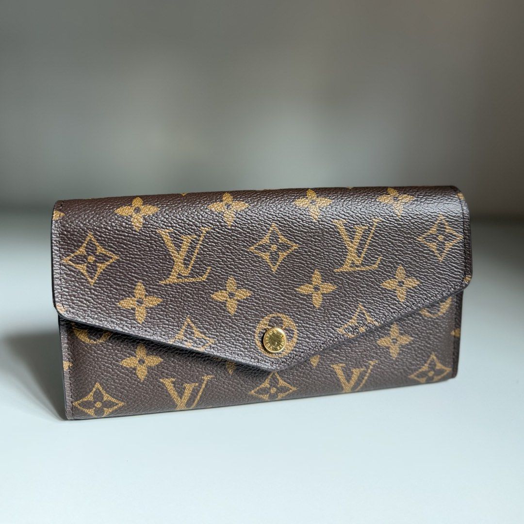 Louis Vuitton Monogram Sarah long Wallet LV (Category: Luxury Bags & Wallets) located in Quezon City. Submitted by ksumer (Listing ID 1455633478, Image 2). Description: - Classic Louis Vuitton monogram wallet - Elegant envelope style with secure snap closure - Ample card slots for organization - Convenient interior zip pocket for coins or essentials - Chic gold hardware accents - Ideal for everyday elegance and practicality.