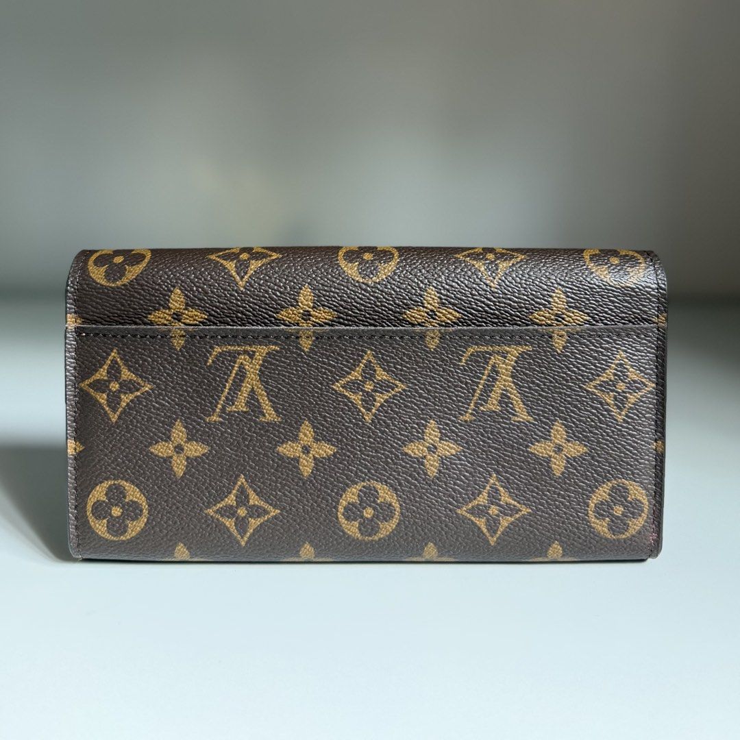 Louis Vuitton Monogram Sarah long Wallet LV (Category: Luxury Bags & Wallets) located in Quezon City. Submitted by ksumer (Listing ID 1455633478, Image 3). Description: - Classic Louis Vuitton monogram wallet - Elegant envelope style with secure snap closure - Ample card slots for organization - Convenient interior zip pocket for coins or essentials - Chic gold hardware accents - Ideal for everyday elegance and practicality.