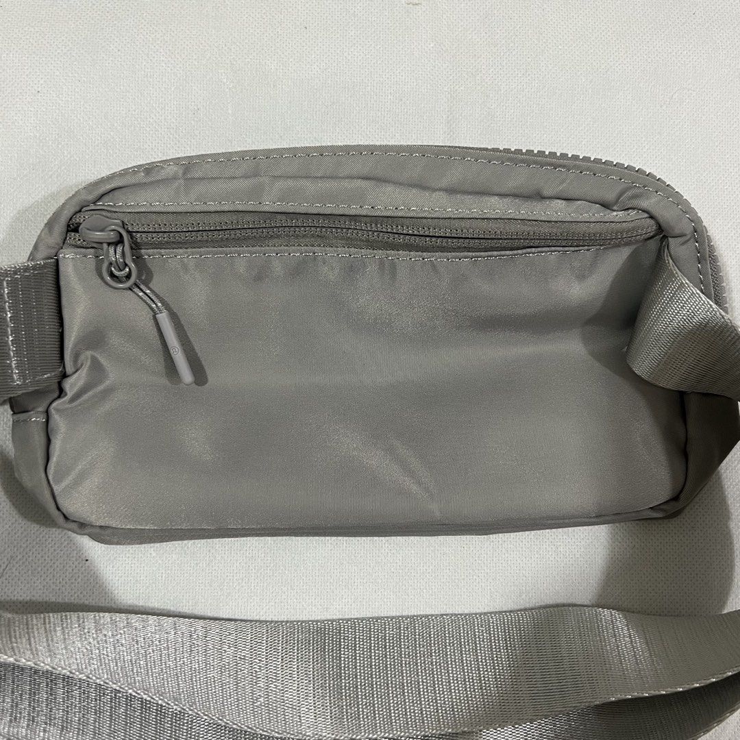 Lululemon Everywhere Belt Bag Grey Nylon (Category: Cross-body Bags) located in Cavite. Submitted by itsayaaa (Listing ID 1455613577, Image 3). Description: - Grey Lululemon Everywhere Belt Bag - Made with 100% nylon body and recycled polyester lining - Internal mesh pocket for organization - Adjustable strap with buckle closure for a custom fit - Secure zippered main compartment and front pocket - Ideal for everyday wear and workouts.