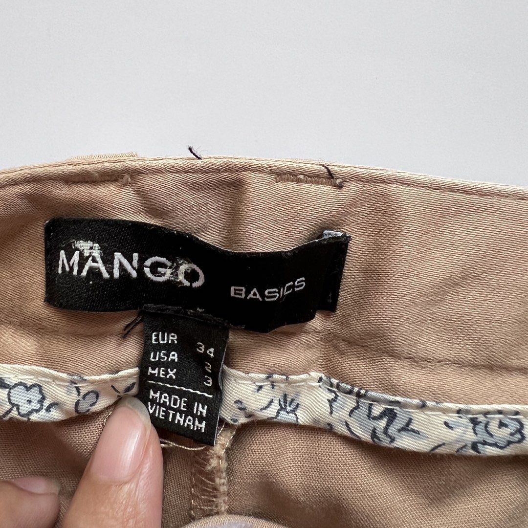 mango basics tan trousers (Category: Other Bottoms) located in Dasmarinas. Submitted by pinex (Listing ID 1455621228, Image 1). Description: - L: 38 in. - W: 14 in. laid flat.