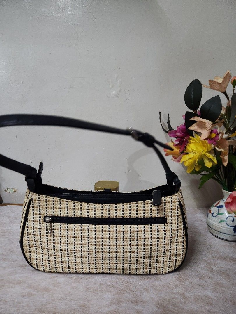 Marie Claire Woven Shoulder Bag (Category: Shoulder Bags) located in Quezon City. Submitted by amber___18 (Listing ID 1455521493, Image 2). Description: - Cute woven shoulder bag from Marie Claire - Tan and black checkered pattern - Black leather strap and trim - Zipper closure with a front zip pocket - Interior zip pocket - Great for everyday use.