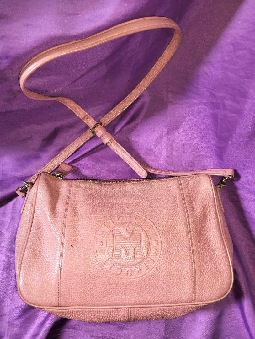 METROCITY Peach color bag Bundle 2pcs (Category: Luxury Bags & Wallets) located in Caloocan City. Submitted by girlshopmcollection (Listing ID 1455611295, Image 2). Description: - Genuine pink leather handbag from METROCITY - Includes a detachable shoulder strap - Comes with a cute tassel charm and a separate cardholder - Beautiful leather texture - Ample interior space for your essentials - Versatile for everyday wear or a night out.