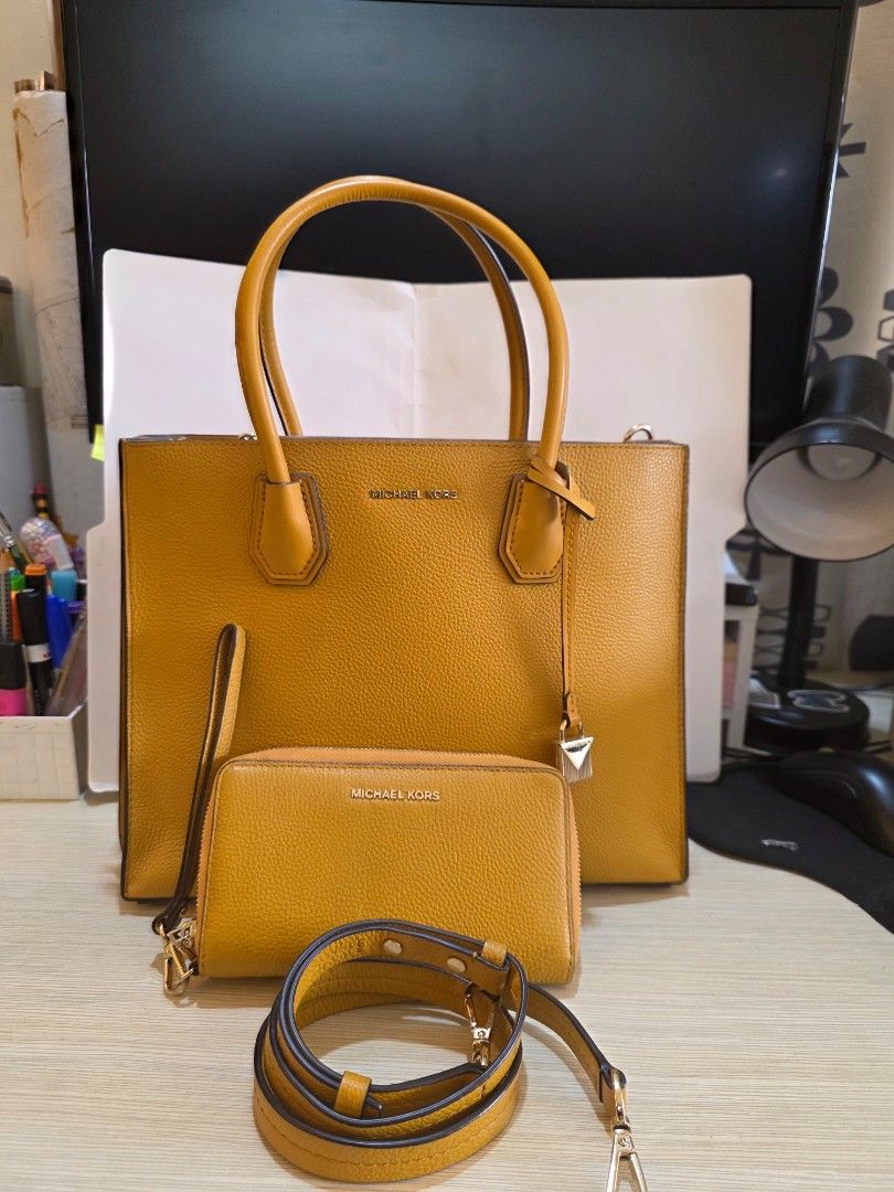 Michael Kors Authentic bag (Category: Luxury Bags & Wallets) located in Paranaque City. Submitted by carlybevs0502 (Listing ID 1455503725, Image 2). Description: personal authentic MK bag, soft leather, mustard yellow in color, gold hardware. in very good condition. Paired with wallet, add P500 only..