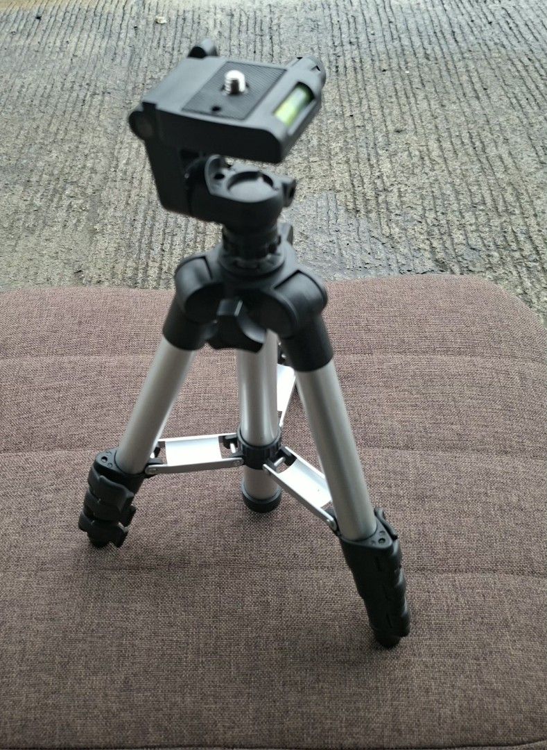 Mini Portable Camera Tripod with Level (Category: Tripods & Monopods) located in Manila. Submitted by glydelmalu86312 (Listing ID 1455548515, Image 2). Description: - Lightweight tripod for cameras - Adjustable legs for various heights - Built-in level for straight shots - Tilt and pan head for flexible framing - Folds compactly for easy storage and transport - Ideal for travel and home photography.