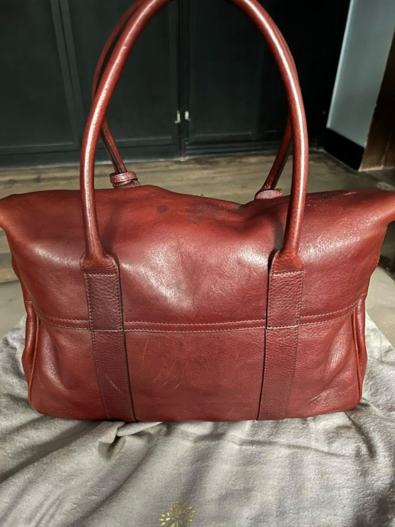 Mulberry Bayswater Red Leather Handbag (Category: Luxury Bags & Wallets) located in Quezon City. Submitted by thriftshopmar (Listing ID 1455515152, Image 2). Description: - Classic Mulberry Bayswater bag - Made from red leather - Features iconic postman's lock closure - Top handles for carrying - Comes with Mulberry dust bag - A timeless piece for your collection.