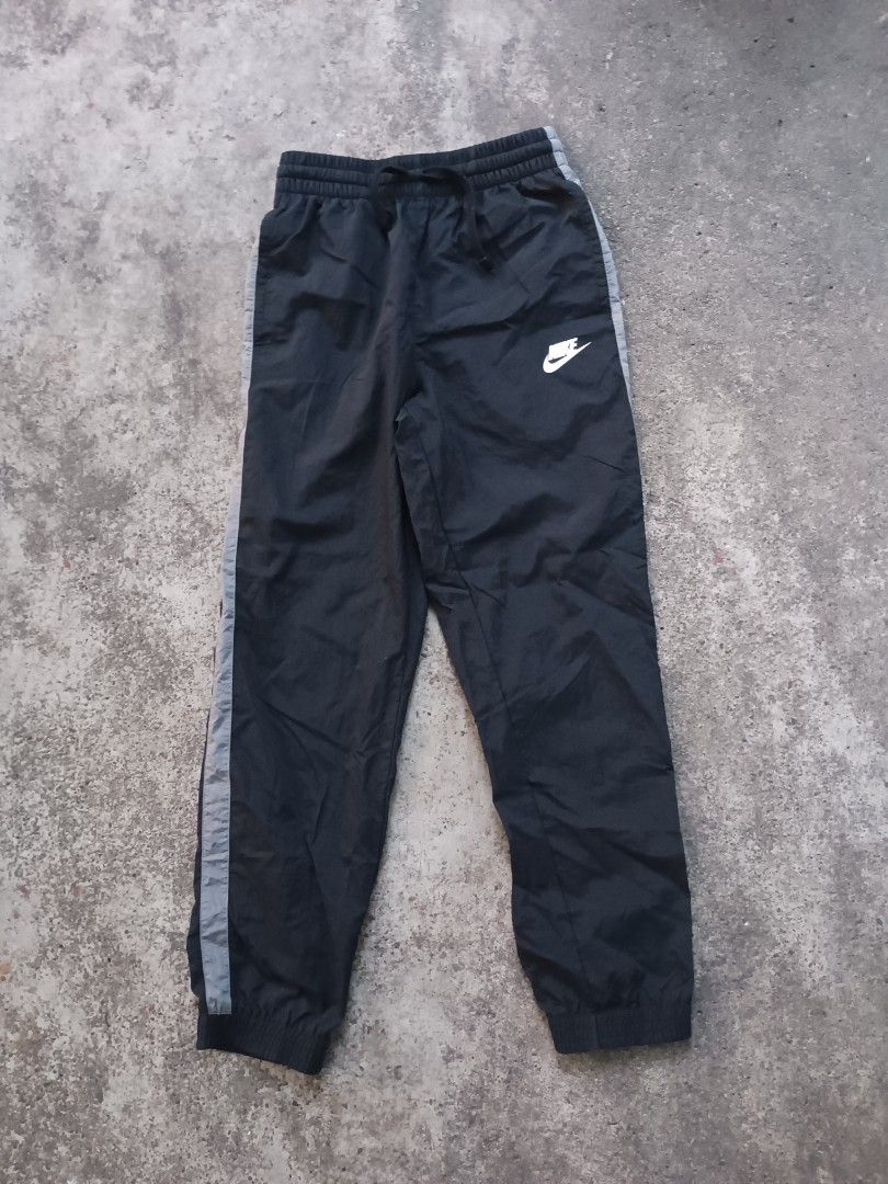 Nike nylon gray striped jogging pants for teens (Category: Joggers) located in Davao. Submitted by hisdef (Listing ID 1455613417, Image 1). Description: Nike nylon gray striped jogging pants for teens Condition- like new issue- none size on tag- large for teens Dimensions in inches waistline-22 up to 30 stretch length-36.