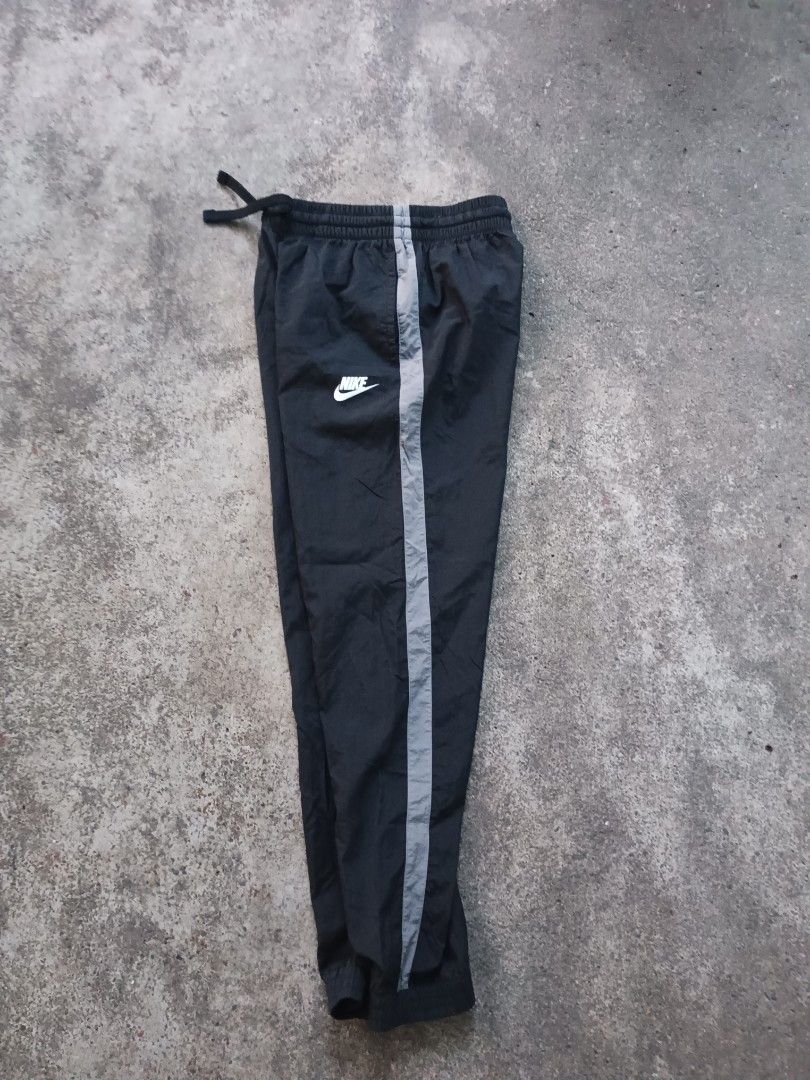 Nike nylon gray striped jogging pants for teens (Category: Joggers) located in Davao. Submitted by hisdef (Listing ID 1455613417, Image 3). Description: Nike nylon gray striped jogging pants for teens Condition- like new issue- none size on tag- large for teens Dimensions in inches waistline-22 up to 30 stretch length-36.