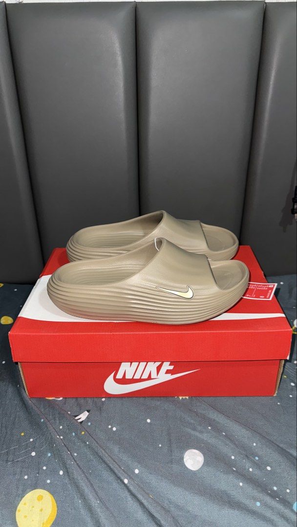 Nike Reactx Rejuven 8 sildes (Category: Slippers & Slides) located in Pasig City. Submitted by misyeloroceo13 (Listing ID 1455615363, Image 1). Description: Nike ReactX Rejuven8 Slides “Khahki” Size 7, 8 mens ₱2395 (SRP 3295).