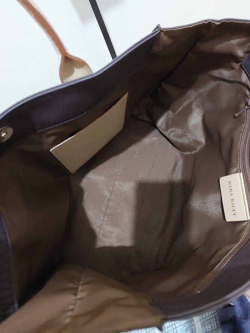 Nina Ricci Monogram Tote Bag (Category: Luxury Bags & Wallets) located in Malabon City. Submitted by jullie_bag_shop (Listing ID 1455535134, Image 3). Description: - Authentic Nina Ricci tote bag - Classic brown with all-over monogram print - Beige leather straps and trim - Secure magnetic snap closure - Interior zip pocket and slip pocket - Ideal for everyday style and practicality.