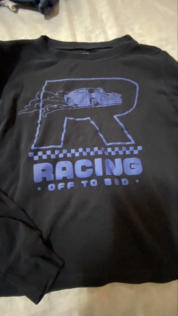 Old Navy Boys' Racing Pajama Set (Category: Babies & Kids Fashion) located in Taguig. Submitted by cosmic.jengck320 (Listing ID 1455505333, Image 3). Description: - Old Navy boys' pajama set - Black long-sleeve shirt with blue 'R' and car graphic - Shirt text: 'RACING OFF TO BED' - Blue and black checkered pajama pants - Comfy sleepwear for kids - Ideal for little racers.