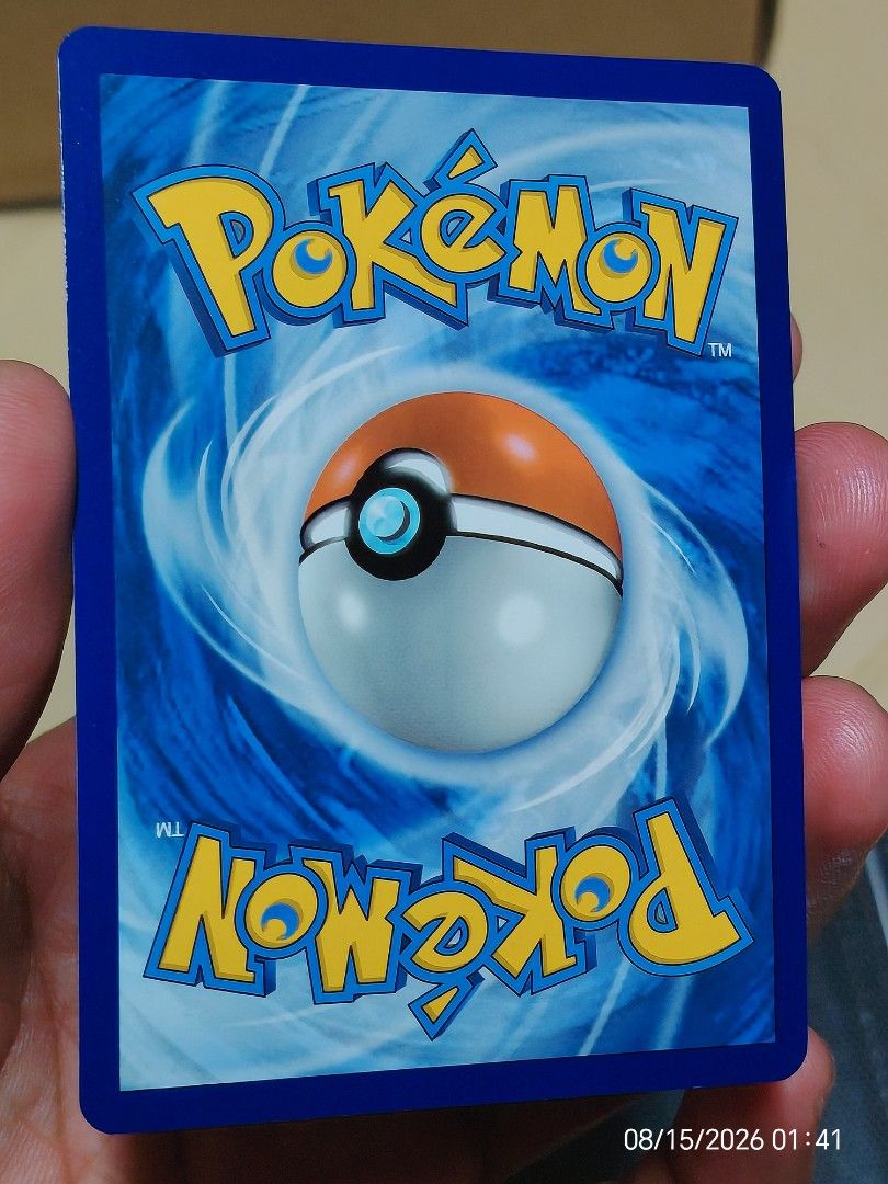 Pecharunt SV EN 149 Pokemon Card (Category: Raw Singles) located in Kalibo. Submitted by anything_random (Listing ID 1455658423, Image 2). Description: - Pecharunt Pokemon Card - SV EN 149 version - Holographic, sparkly finish - Features Pokemon on front, classic logo on back - Perfect for any Pokemon card collector.