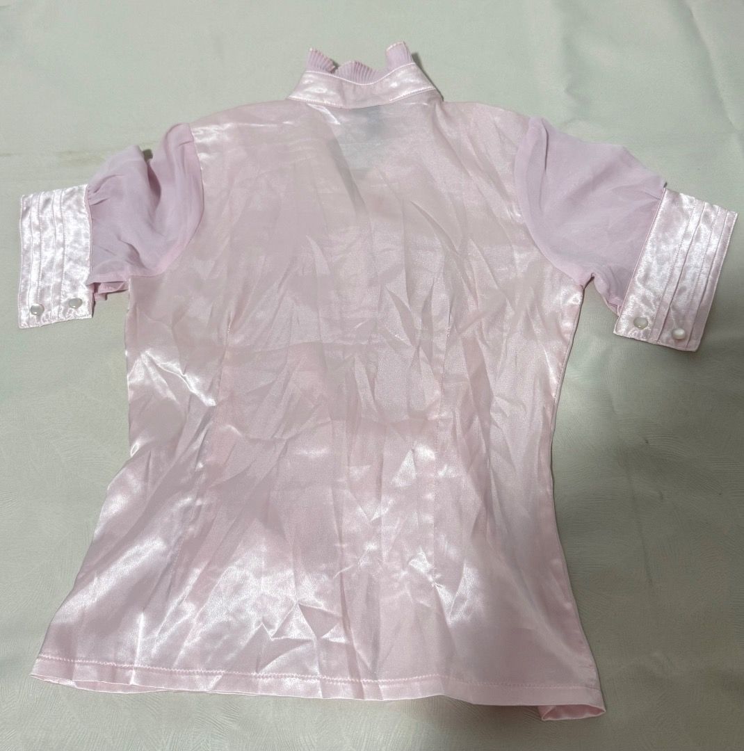 Pink Satin & Chiffon Ruffle Bow Blouse (Category: Blouses) located in Caloocan City. Submitted by livebird_8fda5f (Listing ID 1455635370, Image 2). Description: - Cute pink blouse - Satin front panel - Sheer chiffon short sleeves with ruffled cuffs - Ruffled neckline detail - Adjustable tie bow at the waist - Button-up front closure - Versatile for dressy or casual wear - Small - Coquette .