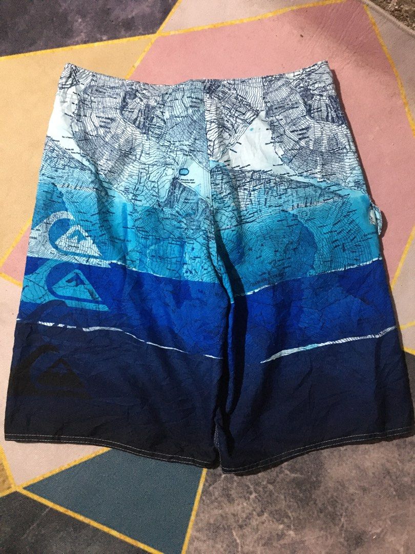 Quiksilver Board Shorts - Blue Map Print (Category: Swim Trunks & Board Shorts) located in Manila. Submitted by findingtreasure. (Listing ID 1455609248, Image 2). Description: - Brand: Quiksilver - Size: 38 - Design: Vibrant blue map print - Features: Drawstring waist, side pocket - Ideal for: Beach, pool, or any adventure.