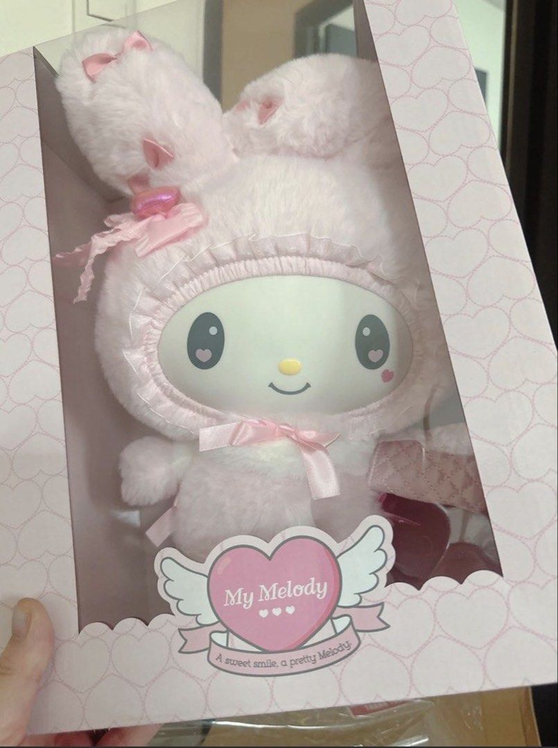 Sanrio My Melody doll - Salome (Category: Plushies & Soft Toys) located in Manila. Submitted by maimero (Listing ID 1453197715, Image 2). Description: - Super cute pink My Melody plush toy. - Comes in its original box. - Features the "A sweet smile, a pretty Melody" tag. - Soft and fluffy texture. - Adorned with charming pink bows. - Ideal for My Melody fans and collectors. - Perfect for display or cuddling..