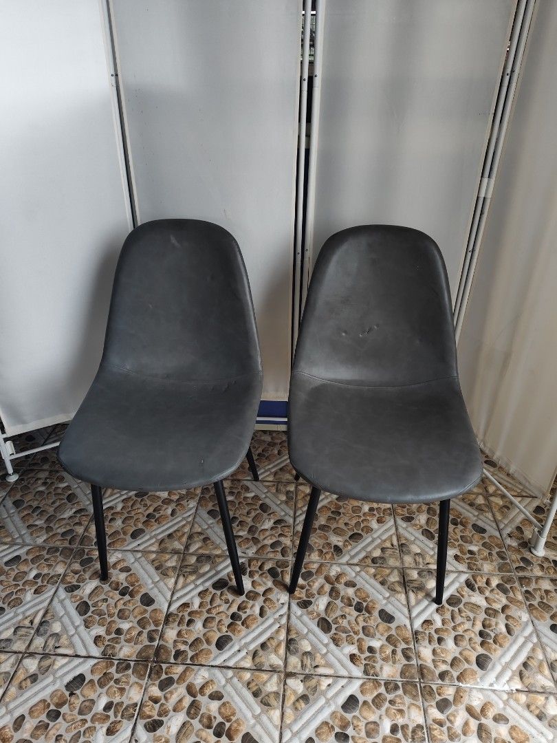 Set of 2 Dark Grey Dining Chairs (Category: Chairs) located in Manila. Submitted by rapidokasm88190 (Listing ID 1455522168, Image 2). Description: - Set of 2 dark grey chairs - Modern design with contoured seats for comfort - Sturdy black metal legs - Approximately 18 inches wide - Perfect for dining or as accent chairs - Pick up only.