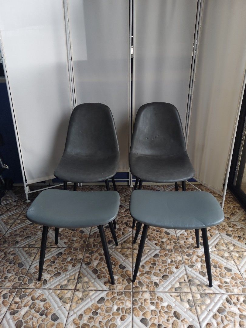 Set of 2 Dark Grey Dining Chairs (Category: Chairs) located in Manila. Submitted by rapidokasm88190 (Listing ID 1455522168, Image 3). Description: - Set of 2 dark grey chairs - Modern design with contoured seats for comfort - Sturdy black metal legs - Approximately 18 inches wide - Perfect for dining or as accent chairs - Pick up only.
