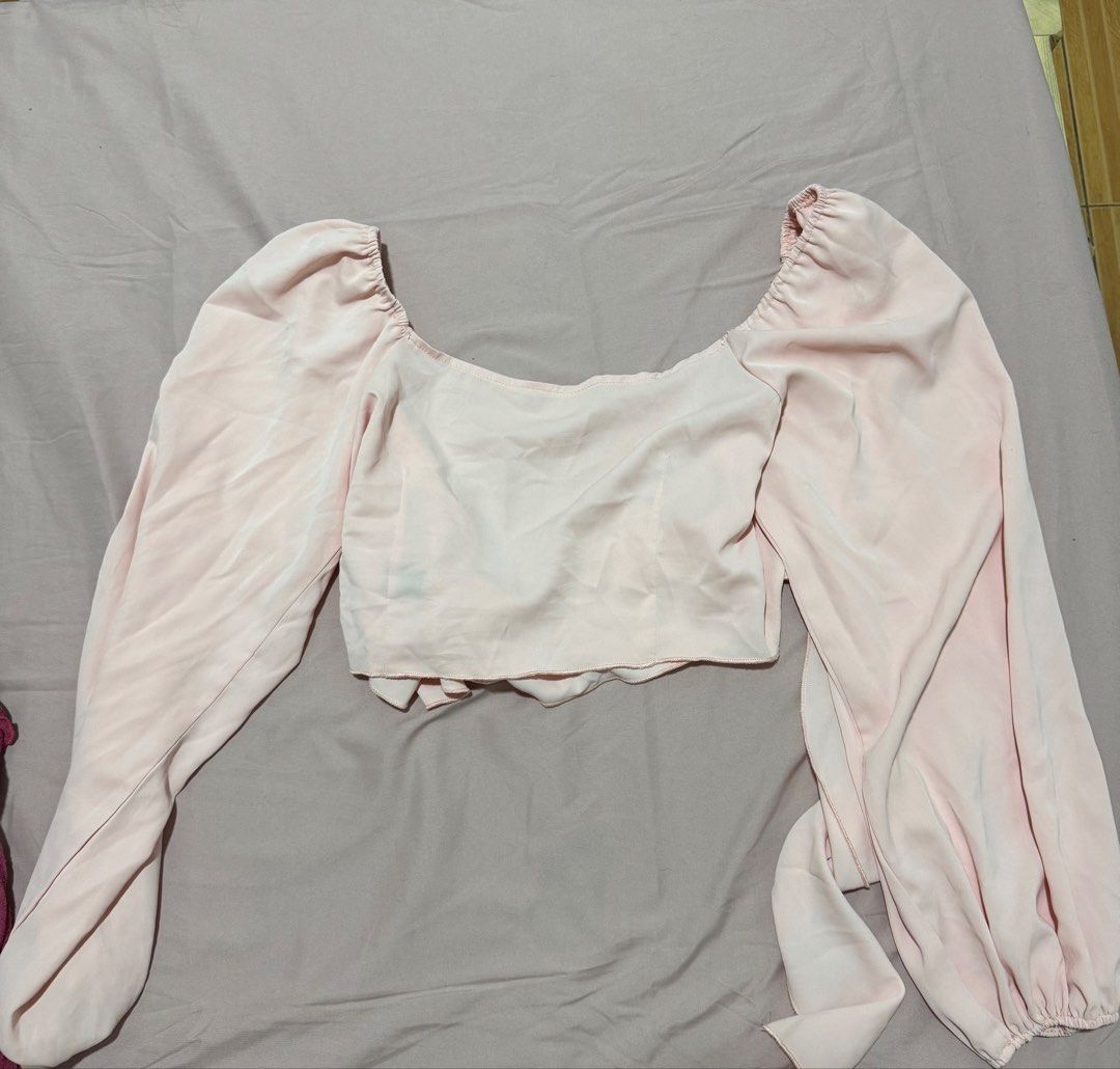Shein Pink Puff long Sleeve Square ribbon tie back (Category: Blouses) located in Muntinlupa City. Submitted by sunwonx (Listing ID 1455607635, Image 1). Description: - Adorable pink crop top - Features stylish puff sleeves - Flattering square neckline - Adjustable tie detail at the back - Fabric has a subtle sheen - Perfect for dressing up or down - Pairs well with jeans or skirts.