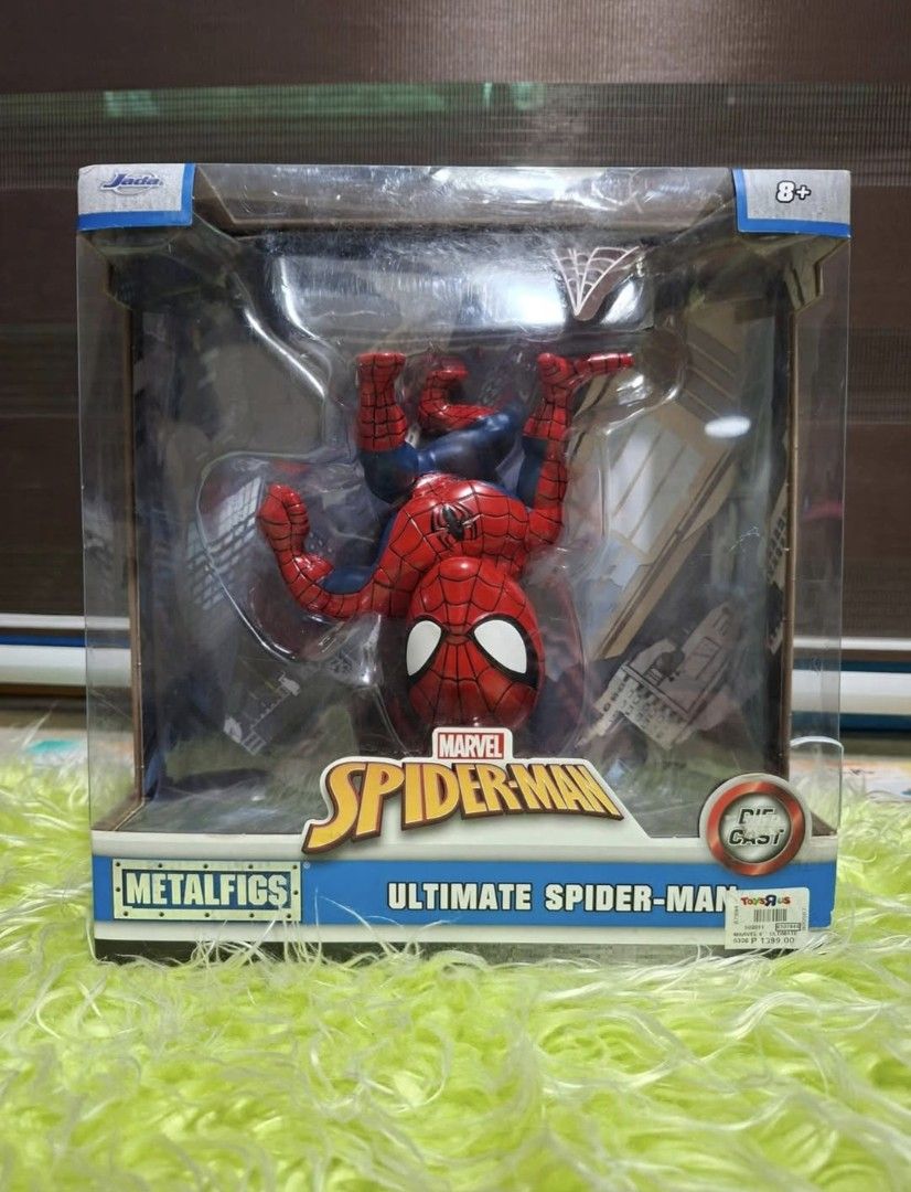 "SPIDER-MAN" Metal Figs ( Jada x Marvel) (Category: Figurines & Statues) located in Manila. Submitted by happywindmarlyn (Listing ID 1455525472, Image 1). Description: - Ultimate Spider-Man Die-cast Figire. - Built primarily from high quality, 100% die- cast metal - Scale: Approx.6 inch - upside down pose attached to a display background structure..
