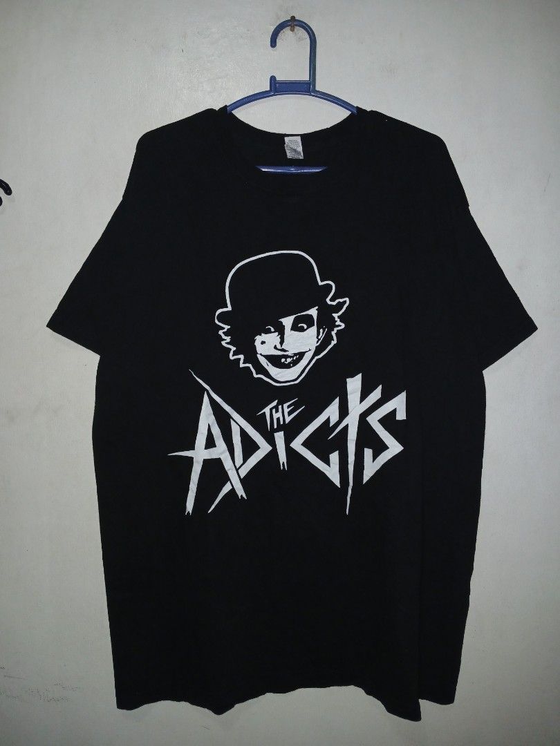 The Adicts Skull T-Shirt (Category: Tshirts & Polo Shirts ) located in Manila. Submitted by ninshok (Listing ID 1455627790, Image 1). Description: - Black t-shirt - Features The Adicts graphic print - Includes skull design and band logo - Small tear on the hem (visible in the last photo) - Perfect for fans of The Adicts.