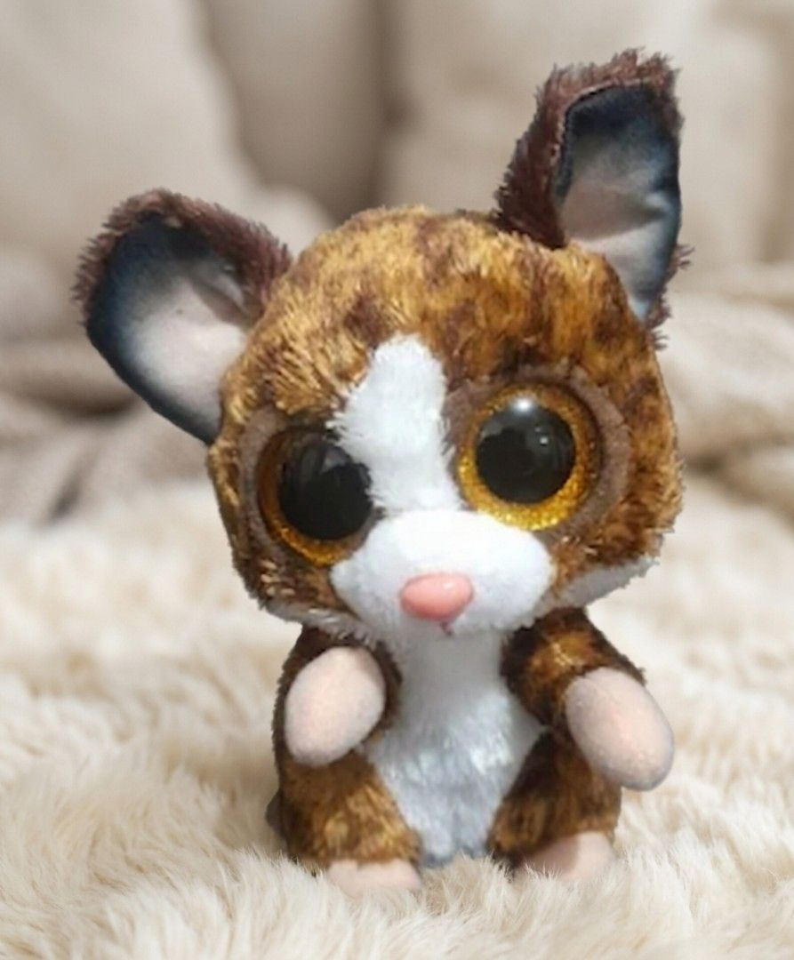 Ty Beanie Boos Plush Toy (Category: Plushies & Soft Toys) located in Quezon City. Submitted by warmturtle.ba931b (Listing ID 1443589460, Image 1). Description: TY Beanie Boos Binky the Bushbaby Plush 🐾 ✨ Authentic TY Beanie Boos plush 🐾 Character: Binky the Bushbaby 🤎 Adorable brown fur with a white face and belly 👀 Features the signature large glittery golden eyes 🩷 Cute peach/pink nose and little pink paws 🥰 Super cute and cuddly design; 