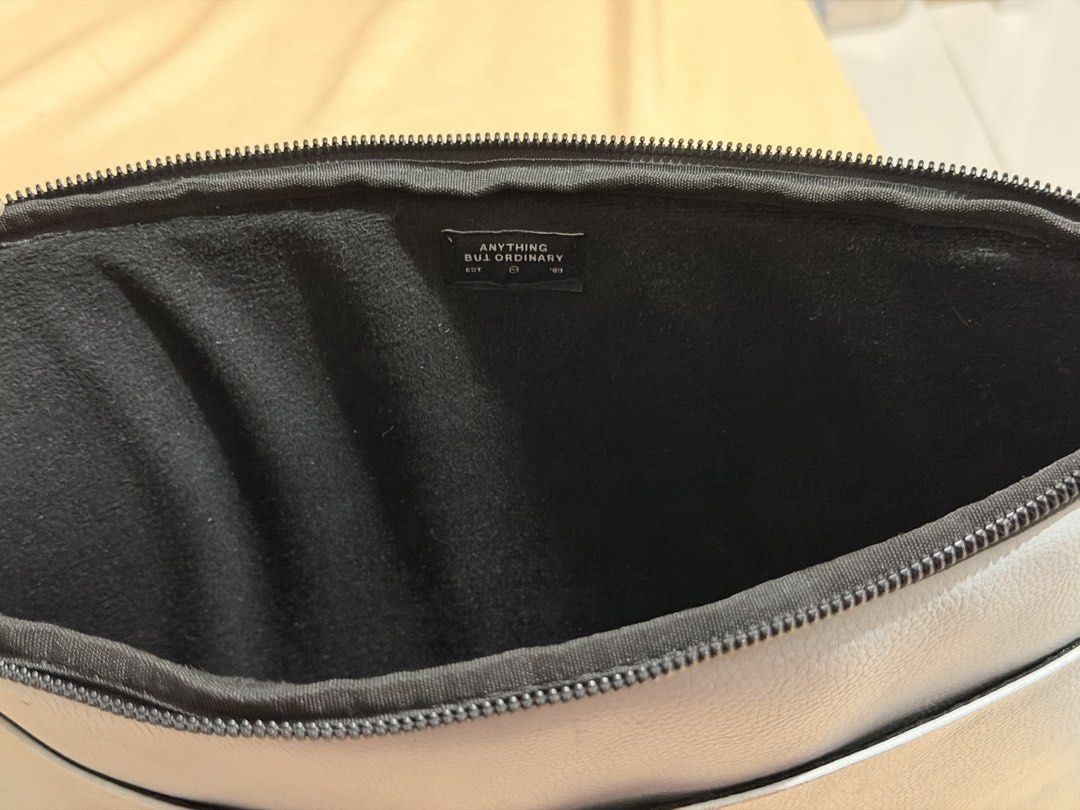 Typo Light blue Laptop Sleeve (Category: Laptop Bags & Sleeves) located in Manila. Submitted by starapple24_ (Listing ID 1455619059, Image 3). Description: - Grey laptop sleeve from Anything But Ordinary - Soft black interior lining - Zipper closure - Small stain on the front (visible in the last photo).